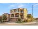 Stylish two-story home with stone accents, balconies, and a three-car garage at 6595 Creekside Cellars Ct, Las Vegas, NV 89139