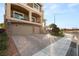 Charming two-story home with a three car garage, brick accents, and front yard landscaping at 6595 Creekside Cellars Ct, Las Vegas, NV 89139