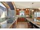 Elegant kitchen with granite countertops, stainless steel appliances, and a well-lit cooking area at 6595 Creekside Cellars Ct, Las Vegas, NV 89139