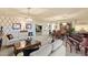 Open living space with hardwood floors, chandeliers and lots of natural light at 6595 Creekside Cellars Ct, Las Vegas, NV 89139
