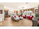 Spacious open-concept layout featuring wood floors, a modern kitchen, and comfortable living area at 6595 Creekside Cellars Ct, Las Vegas, NV 89139