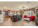 Bright open-concept living room featuring hardwood floors and comfortable seating at 6595 Creekside Cellars Ct, Las Vegas, NV 89139