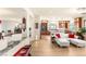 Bright and spacious living room with wood floors, an open layout, and seamless flow to the kitchen at 6595 Creekside Cellars Ct, Las Vegas, NV 89139