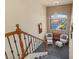 Second floor landing area with reading nook, eye-catching wall paper and decorative chandelier at 6595 Creekside Cellars Ct, Las Vegas, NV 89139