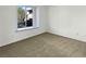 Spacious bedroom with neutral carpeting and large window at 7200 Pirates Cove Rd # 1008, Las Vegas, NV 89145