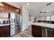 Kitchen with stainless steel refrigerator and dark wood cabinets at 7324 Tin Mine Ave, Las Vegas, NV 89179