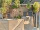 House with backyard featuring a pergola and stone pathway at 7611 Leybourne Ct, Las Vegas, NV 89131