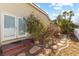 Landscaped backyard with stone pathway and mature plants at 7611 Leybourne Ct, Las Vegas, NV 89131
