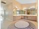 Spa-like bathroom with double sinks, large mirror, and sauna at 7611 Leybourne Ct, Las Vegas, NV 89131