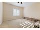 Simple bedroom with carpeted floor and window at 7611 Leybourne Ct, Las Vegas, NV 89131