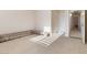 Bedroom with carpet, rolled rugs, and hallway access at 7611 Leybourne Ct, Las Vegas, NV 89131