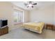 Bedroom with large window, ceiling fan and ample closet space at 7611 Leybourne Ct, Las Vegas, NV 89131