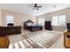 Main bedroom with a king bed, office space, and large windows at 7611 Leybourne Ct, Las Vegas, NV 89131