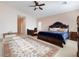 Main bedroom with king bed and a sitting area at 7611 Leybourne Ct, Las Vegas, NV 89131
