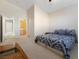 Large bedroom with king bed, ensuite bath, and access to hallway at 7611 Leybourne Ct, Las Vegas, NV 89131