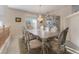 Bright dining room featuring a large table and elegant cabinetry at 7611 Leybourne Ct, Las Vegas, NV 89131