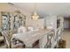 Spacious dining room with a beautiful chandelier and hutch at 7611 Leybourne Ct, Las Vegas, NV 89131