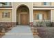 Elegant double front doors with arched entryway and sidelights at 7611 Leybourne Ct, Las Vegas, NV 89131