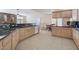 Modern kitchen with granite countertops and light wood cabinets at 7611 Leybourne Ct, Las Vegas, NV 89131