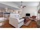 Open living room with hardwood floors, high ceilings and views to kitchen at 7611 Leybourne Ct, Las Vegas, NV 89131