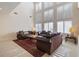 Bright living room with large windows and comfortable seating at 7611 Leybourne Ct, Las Vegas, NV 89131