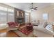 Living room features stone fireplace, hardwood floors and access to backyard at 7611 Leybourne Ct, Las Vegas, NV 89131
