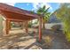 Wooden pergola provides shade and seating area at 7611 Leybourne Ct, Las Vegas, NV 89131