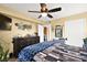 Bright bedroom featuring a ceiling fan and ample closet space at 8101 W Flamingo Rd # 1104, Las Vegas, NV 89147