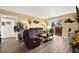 Living room with brown sofas, a coffee table and access to the balcony at 8101 W Flamingo Rd # 1104, Las Vegas, NV 89147