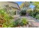 Landscaped backyard with stone pathway, featuring a variety of plants and a relaxing atmosphere at 8904 Martin Downs Pl, Las Vegas, NV 89131