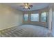 Bright bedroom with carpeted floor and large windows at 8904 Martin Downs Pl, Las Vegas, NV 89131