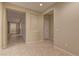 Light beige hallway with tile floors and access to other rooms at 8904 Martin Downs Pl, Las Vegas, NV 89131