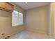 Laundry room with shelving and built-in storage at 8904 Martin Downs Pl, Las Vegas, NV 89131