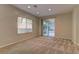 Living area with sliding doors leading to the backyard at 8904 Martin Downs Pl, Las Vegas, NV 89131