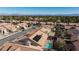 Aerial view of houses with solar panels and pools, showcasing the community and mountain views at 9109 Lazy Hill Cir, Las Vegas, NV 89117