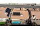 Aerial view of a house featuring solar panels and a refreshing blue swimming pool at 9109 Lazy Hill Cir, Las Vegas, NV 89117
