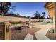 Spacious backyard oasis with pool, fountain, and seating area at 9109 Lazy Hill Cir, Las Vegas, NV 89117