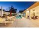 Inviting backyard with refreshing pool, lounge chairs, and covered patio perfect for relaxing at the end of the day at 9109 Lazy Hill Cir, Las Vegas, NV 89117