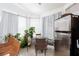Bright breakfast nook with natural light and a stainless-steel refrigerator at 9109 Lazy Hill Cir, Las Vegas, NV 89117