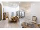 Inviting formal dining room with tall ceilings, modern chandelier, and views into the formal living room at 9109 Lazy Hill Cir, Las Vegas, NV 89117