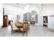 Formal dining room with large table, ornate chairs, and hardwood floors at 9109 Lazy Hill Cir, Las Vegas, NV 89117