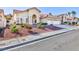 Single-story home with two-car garage and landscaped yard at 9109 Lazy Hill Cir, Las Vegas, NV 89117