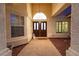 Charming front entrance featuring double doors, an arched window, and manicured landscaping at 9109 Lazy Hill Cir, Las Vegas, NV 89117