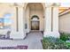 Inviting home entryway featuring grand columns and decorative glass paneled double doors that lead into the home at 9109 Lazy Hill Cir, Las Vegas, NV 89117