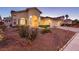 Charming single-story home with well-maintained desert landscaping, an arched entryway, and a two car garage at 9109 Lazy Hill Cir, Las Vegas, NV 89117