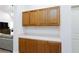 Hallway featuring white walls, base cabinets, and view of living room at 9109 Lazy Hill Cir, Las Vegas, NV 89117