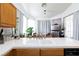 Kitchen featuring white countertop, dining table, neutral tones and ample natural light at 9109 Lazy Hill Cir, Las Vegas, NV 89117