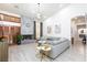 Bright living room featuring a concrete fireplace, wood shutters, and contemporary decor at 9109 Lazy Hill Cir, Las Vegas, NV 89117