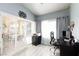 Bright office space featuring large windows with shutters and curtains for natural light at 9109 Lazy Hill Cir, Las Vegas, NV 89117