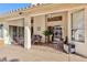 Covered patio featuring ceiling fan, seating and view to back yard at 9109 Lazy Hill Cir, Las Vegas, NV 89117